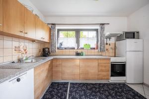 Kuchyň nebo kuchyňský kout v ubytování Vakantiehuis Cerny Dul 259