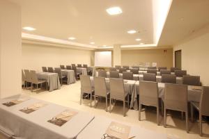 a conference room with tables and chairs in it at Silken Axis Vigo in Vigo