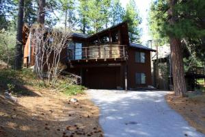 a house with a balcony on the side of it at 2 bedroom, 2 bath, sleeps 6 Direct Donner Lake Access DLR#038 in Truckee