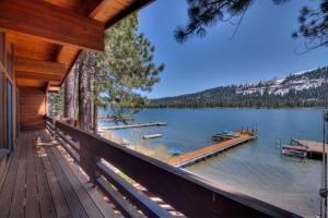 a view of a lake from the porch of a house at 3 bedroom and Den, 3 and a half bath, sleeps 12, Lakefront with private dock DLR#004 in Truckee