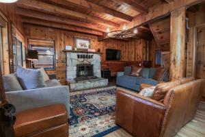 a living room with a couch and a fireplace at 3 bedroom, 2 bath Sleeps 8 adults Direct Lake Access DLR#041 in Truckee