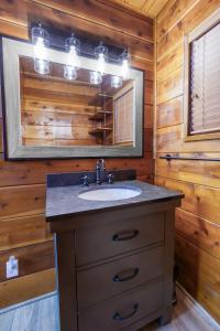 a bathroom with a sink and a mirror at 3 bedroom, 2 bath Sleeps 8 adults Direct Lake Access DLR#041 in Truckee