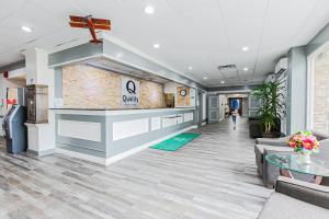 a lobby of a church with a cross on the wall at Quality Inn Dayton Airport in Englewood +63 photos
