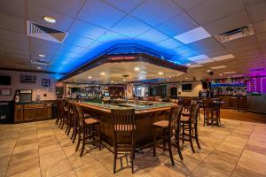 a bar in a restaurant with chairs around it at Quality Inn Dayton Airport in Englewood