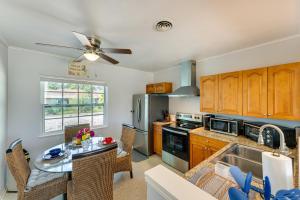 a kitchen with a table and a dining room at Pet-Friendly Venice Vacation Rental, 3 Mi to Beach in Venice