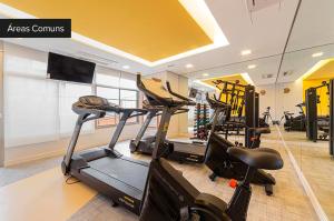a gym with three exercise bikes in a room at Charlie Girassol Vila Madalena in Sao Paulo
