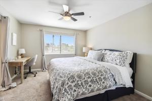 a bedroom with a bed and a desk and a window at Biltmore Bliss Desert Retreat! in Phoenix +44 photos