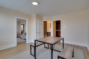 an empty living room with a table and a couch at Hatboro Retreat Steps From Shopping and Dining! 