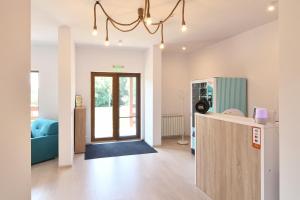 a living room with a kitchen with a refrigerator at Eden Uzlina in Uzlina +37 photos