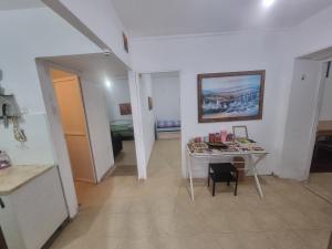 a room with a table and a room with a bedroom at בית על חצי דונם במרכז קרית שמונה in Qiryat Shemona