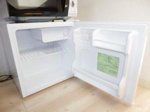 a small white refrigerator with its door open at The Mickey Carlton Ohashi Alpha Coat - Vacation STAY 15164 in Fukuoka