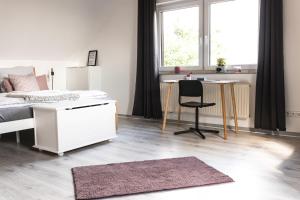 Postel nebo postele na pokoji v ubytování Auszeit Altenhorst, Gartenferienwohnung
