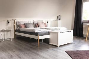 Postel nebo postele na pokoji v ubytování Auszeit Altenhorst, Gartenferienwohnung
