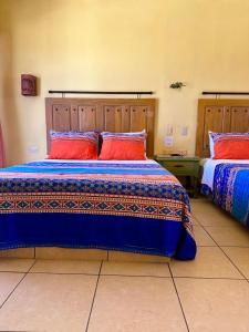 Postel nebo postele na pokoji v ubytování Siesta Suites Boutique Hotel