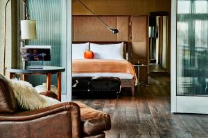 a hotel room with a bed and a couch at Soho Grand Hotel in New York