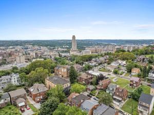 an aerial view of a city with a tall tower at Oakland/University @G Modern and Bright Private Bedroom with Shared Bathroom in Pittsburgh