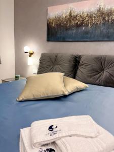 Un ou plusieurs lits dans un hébergement de l'établissement Notti Saracene Rooms