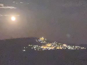 a view of a city lit up at night at Casa do Vale - Douro, Casa Rural de Campo com Piscina privada, 4 quartos de casal in Vilar de Maçada