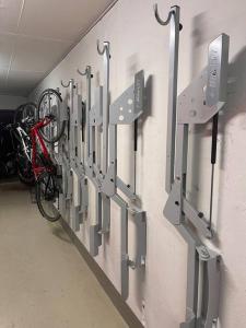 a wall with a bunch of bike racks on a wall at Studio centralissimo a St. Moritz in St. Moritz