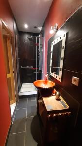 a bathroom with a sink and a shower at Les longères du Trieux in Lézardrieux +32 photos