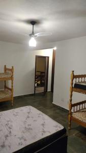 En eller flere senge i et værelse på Fazenda Água Clara