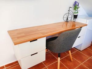 a desk with a chair in a room at Selwo Studio in Estepona