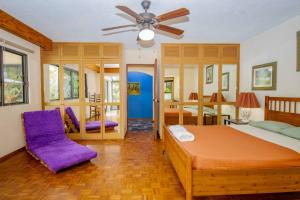 a bedroom with two beds and a ceiling fan at ¡Nueva! Bamboo CASA ARTE in Cuernavaca +36 photos