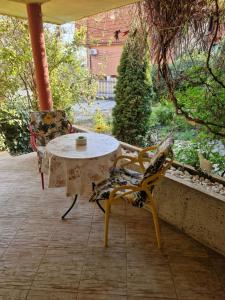a table and chairs sitting on a patio at Villa Residence, free parking, pets friendly in Varna City