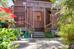 a house with a red door and wooden stairs at WFH-Friendly Berkeley Home Less Than 2 Mi to University! in Berkeley