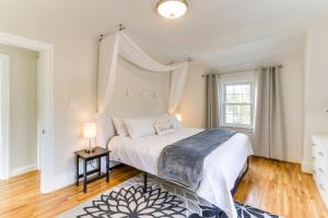 a bedroom with a large bed and a window at Chic Front Royal Retreat Near Shenandoah River! in Front Royal