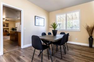a dining room with a table and chairs at The Nest at Woodside: Lux LA getaway + office/spa in Santa Clarita