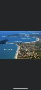 an aerial view of a beach and the ocean at Eu Sou do Mar apto térreo 1 in Palhoça