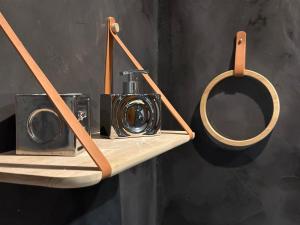 a wooden shelf with a camera on it at Andromeda Suites in Athens