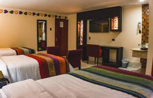 Postel nebo postele na pokoji v ubytování Altipacha Ayacucho Hotel