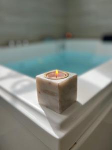 a small candle sitting on top of a table at Studio Cosy spa in Montmagny
