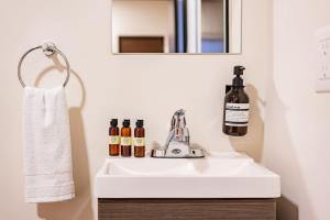 a bathroom with a white sink and a mirror at Lofts & apartments Near Polanco by VH in Mexico City