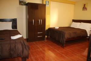 Postelja oz. postelje v sobi nastanitve Pachamama Hostel
