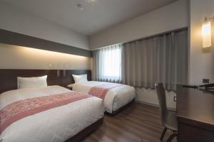 Krevet ili kreveti u jedinici u okviru objekta Nagoya Kanayama Hotel