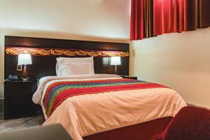 Postel nebo postele na pokoji v ubytování Altipacha Ayacucho Hotel