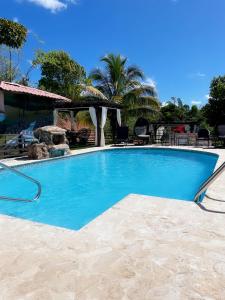 a large blue swimming pool in a resort at Casa Campo Bed & Breakfast in San Sebastian