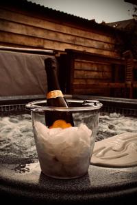 a bottle of champagne in a bucket with an orange at Balcarres, Rodborough Avenue in Stroud