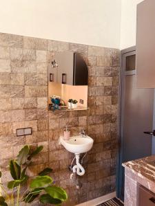 a bathroom with a sink and a mirror at WOW beach house in Imsouane +64 photos