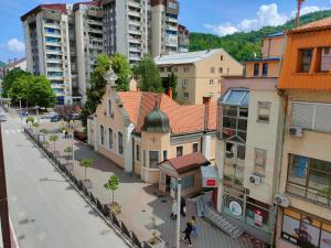 a group of buildings on a street in a city at Apartman Aleksandar in Zvornik
