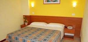 Postel nebo postele na pokoji v ubytování Albergo San Gabriele