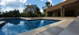 a swimming pool in the backyard of a house at Quinta Germania in Garupá
