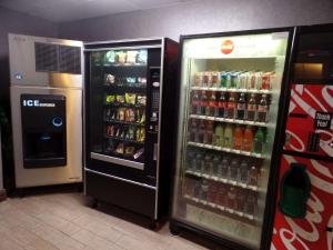 two soda machines are next to each other at Hampton Inn Bowling Green in Bowling Green