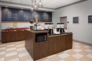 a fast food restaurant with a counter with food at Hampton Inn Louisville Downtown in Louisville