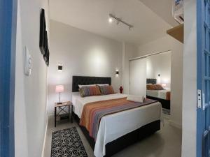 מיטה או מיטות בחדר ב-BestHostRio - Ideal para casais e perto da praia