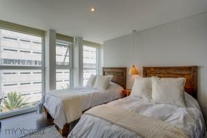 Posteľ alebo postele v izbe v ubytovaní Nuevo Leon PH - Cozy & Renovated PH with Exclusive Design in Condesa