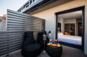 a bedroom with a bed and a large window at NYX Hotel Madrid by Leonardo Hotels in Madrid